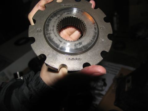 1978 Ford Bronco - Close-up of a metal gear part, identified by the FoMoCo marking.