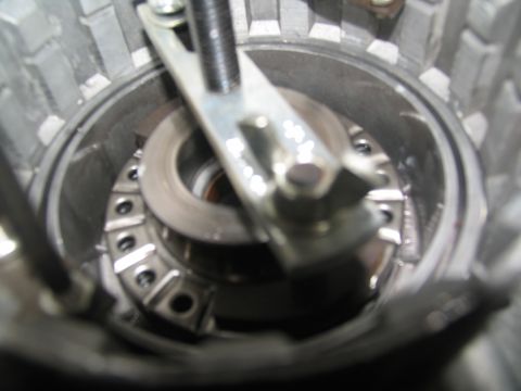 1978 Ford Bronco - A tool is shown engaging with a clutch pack within a transmission assembly.