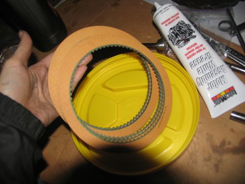 1978 Ford Bronco - Transmission clutch plates and a tube of assembly grease are shown, likely for a rebuild project.