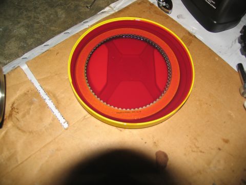 1978 Ford Bronco - A transmission clutch pack is shown in a container, suggesting a vehicle repair or rebuild process.