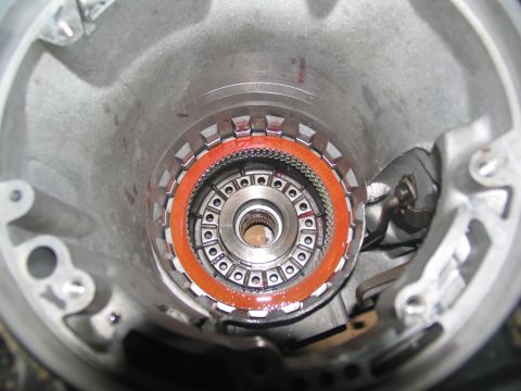 1978 Ford Bronco - Close-up view of a transmission torque converter, showing internal components and an orange seal.