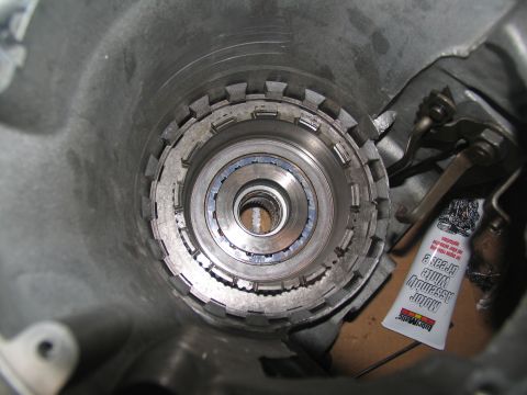 1978 Ford Bronco - Internal view of a transmission drum, showing splines and clutch pack components. A tube of assembly grease is also present.