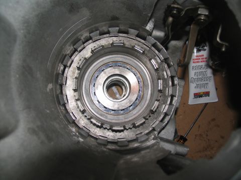 1978 Ford Bronco - A close-up view of an automatic transmission's clutch pack, with a tube of white assembly grease visible.