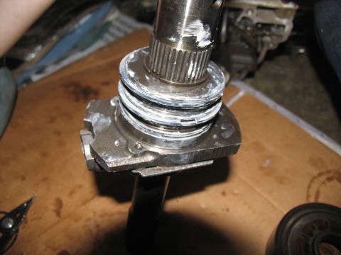 1978 Ford Bronco - A close-up view of a disassembled transmission component, showing metal parts and grease.