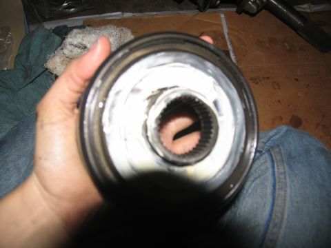 1978 Ford Bronco - A close-up view of a greased metal component, likely a part of a vehicle's transmission.