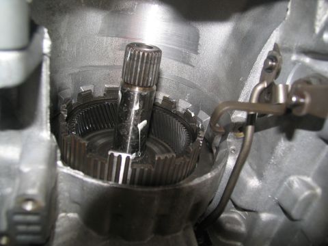 1978 Ford Bronco - Internal view of a transmission, showing a splined shaft and gear assembly during a rebuild.