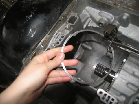 1978 Ford Bronco - Close-up of a transmission component being held by a hand.
