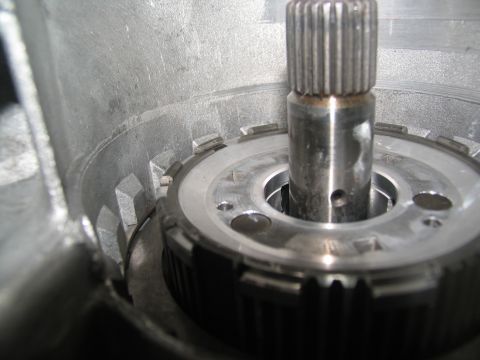 1978 Ford Bronco - A close-up view of internal transmission components, showing a splined shaft and a geared ring.