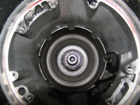 1978 Ford Bronco - Interior view of a transmission torque converter housing, showing internal splines and metal casing.