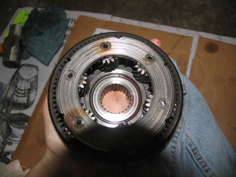 1978 Ford Bronco - Differential planetary gear set with visible gears and splines, held in a hand.
