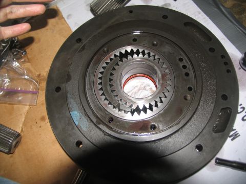 1978 Ford Bronco - A close-up view shows the intricate splines and gears of a transmission component, possibly during a rebuild.