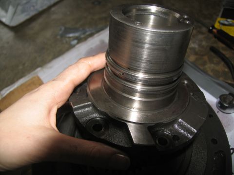 1978 Ford Bronco - Close-up of a transmission part being handled, likely during a rebuild or repair.