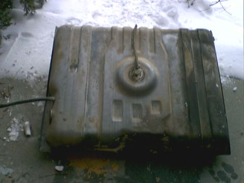 1973 Ford Ranchero - This is a fuel tank, likely from a vehicle, shown in a snowy outdoor setting.