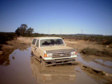 1990 Ford Bronco - This 1987 Ford Bronco is stuck in the mud, with its front end submerged.