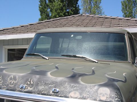1978 Ford Bronco - A 1978 Ford Bronco with custom flame and skull artwork is seen from the front.