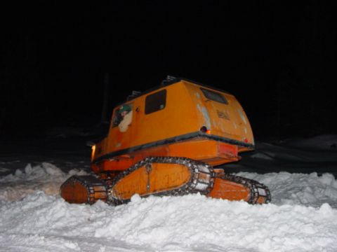 1986 Ford Bronco - This tracked vehicle appears to be a snow groomer or similar utility vehicle.
