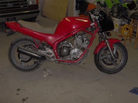 1993 Yamaha Seca II - A red Yamaha motorcycle is parked indoors, with a truck visible in the background.
