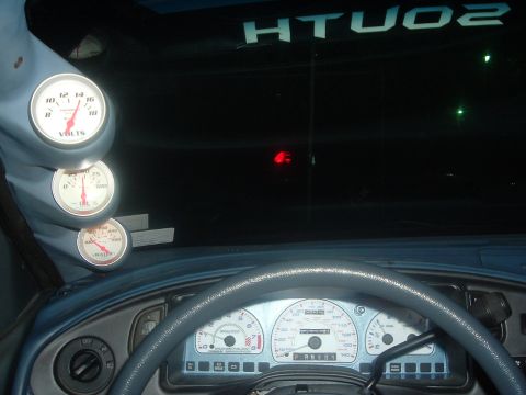 1993 Ford Taurus - Interior view of a car's dashboard with multiple gauges and a steering wheel.
