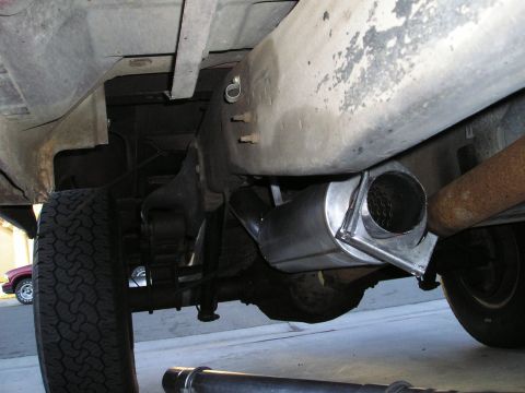 1997 Ford F-250 - Close-up of a truck's undercarriage, highlighting a newly installed exhaust system.