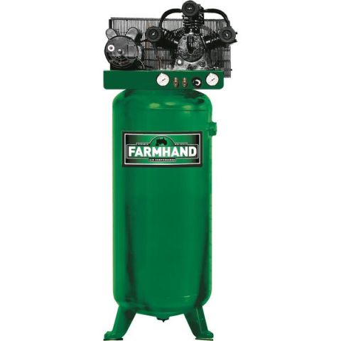 1995 Ford Bronco - This Farmhand air compressor features a tall green tank and a visible pump assembly with gauges.