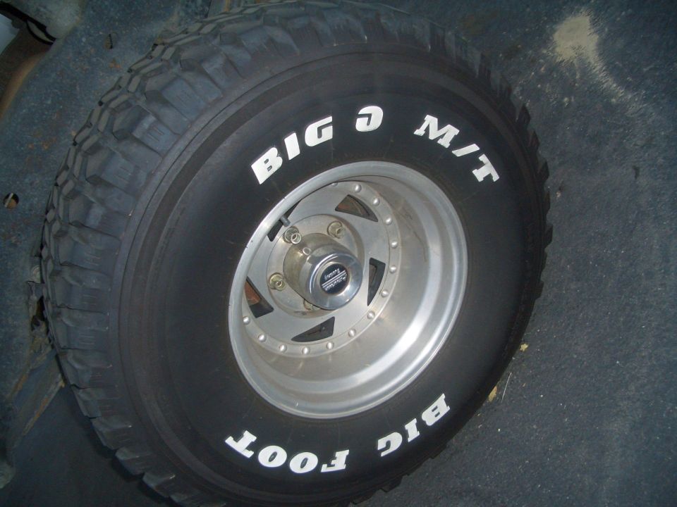 Spare tire with white lettering 'BIG O M/T' and 'BIG FOOT' on a silver multi-spoke wheel
