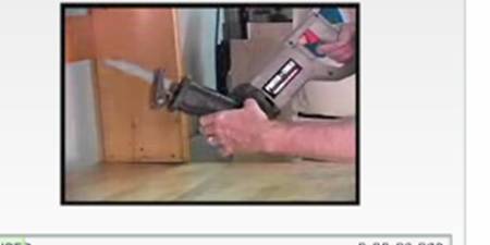 1990 Ford Bronco - A reciprocating saw is used to cut into a wooden object.