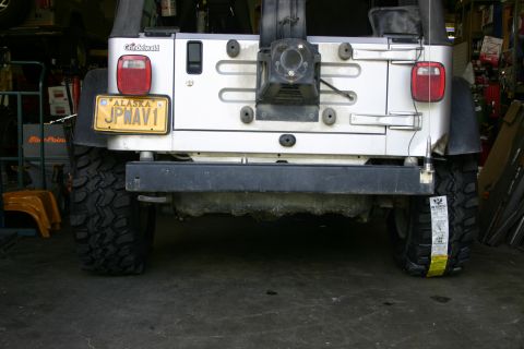 2003 Jeep TJ - Rear view of a silver Jeep Wrangler with an Alaska license plate.