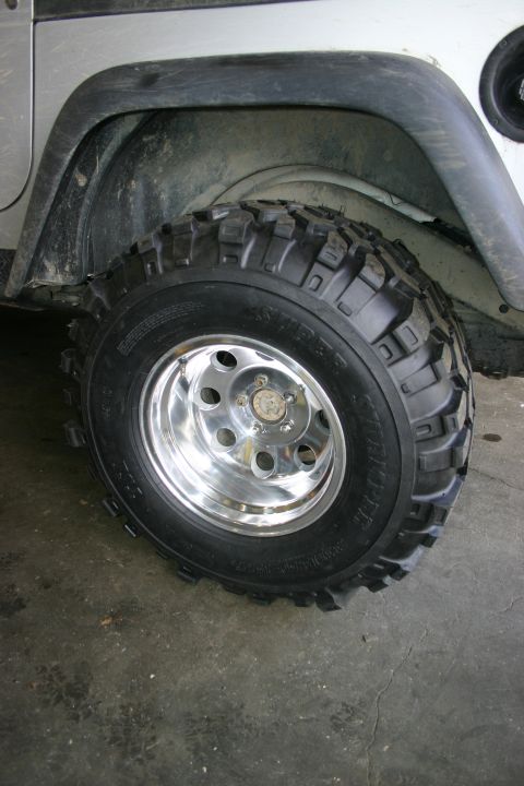 2003 Jeep TJ - This 2003 Jeep TJ features chrome wheels and off-road tires, hinting at its adventurous capabilities.