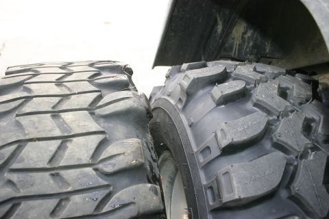 2003 Jeep TJ - Comparison of a worn off-road tire next to a new one.
