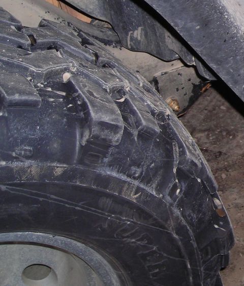 2003 Jeep TJ - A close-up view of a tire with aggressive tread, likely for off-road use.