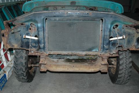 1963 Ford F-250 - The front clip of a 1956 Ford F-100 truck, showing significant rust and disassembly.