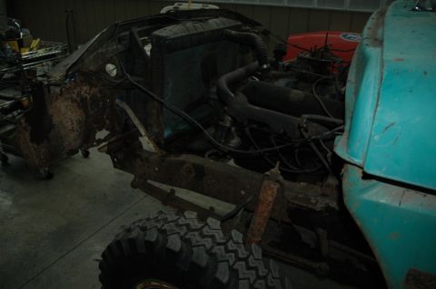 1963 Ford F-250 - Disassembled 1963 Ford F-250 showing the engine and chassis with a turquoise cab section.