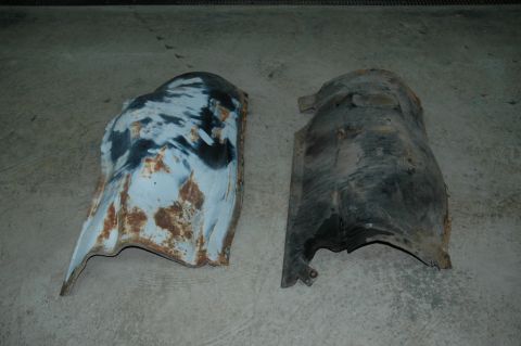 1963 Ford F-250 - Two fender skirts, likely for a classic truck, are shown on a concrete floor.