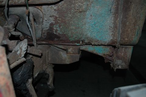 1963 Ford F-250 - Detail of heavily rusted frame and bodywork, showing significant corrosion and damage.