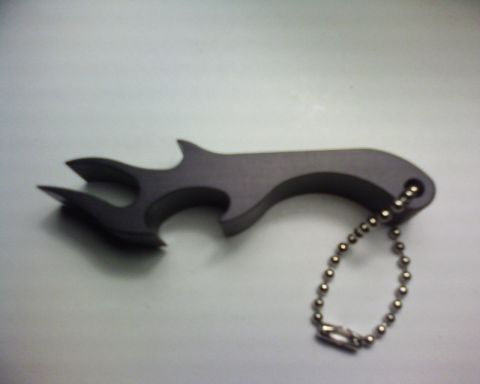 1995 Ford Bronco - This flame-shaped bottle opener with a keychain also features the Supermotors logo at the bottom right.