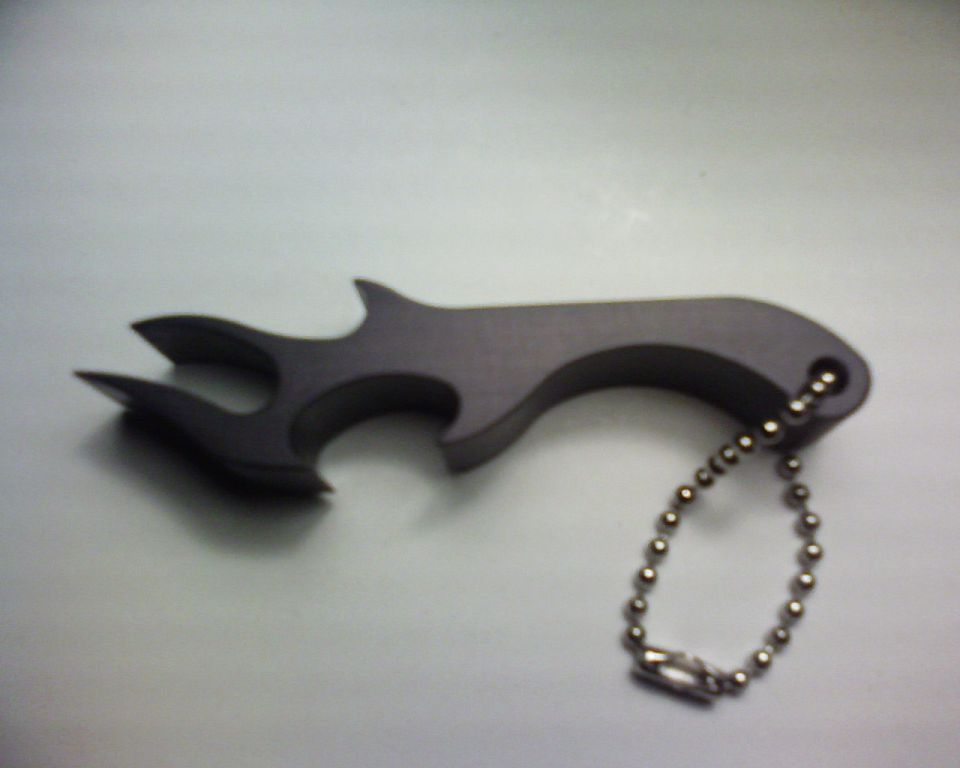 Flame-shaped bottle opener with keychain and Supermotors logo