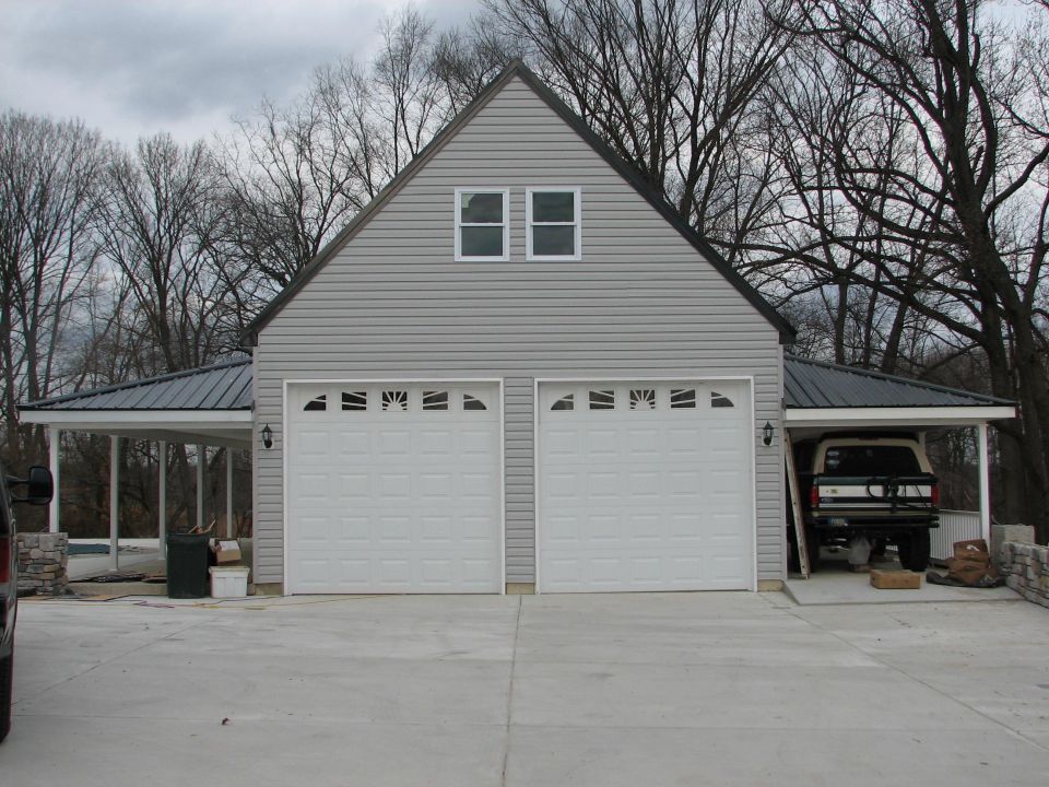 Doors installed parking pad complete (5 flush drains installed)