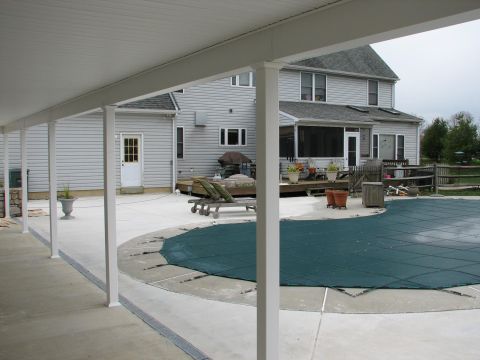 1992 Ford Bronco - A backyard scene a covered swimming pool and a two-story house with a screened-in porch.