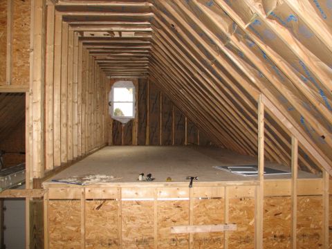 1992 Ford Bronco - Attic space under construction, showing framing and insulation before finishing.