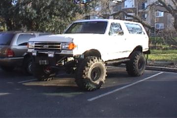 1991 Ford Bronco - With the new meats. Now I need to cut the fenders!