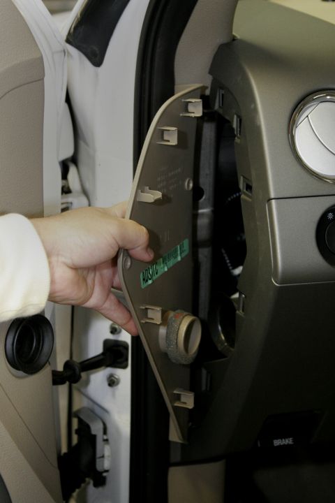 2005 Ford F-150 - Start by removing the drivers side dash access panel.