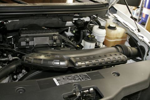 2005 Ford F-150 - Now that the programmer is done we can move on to the engine bay. The stock intake is large, ugly, and a little intimidating in its complex…