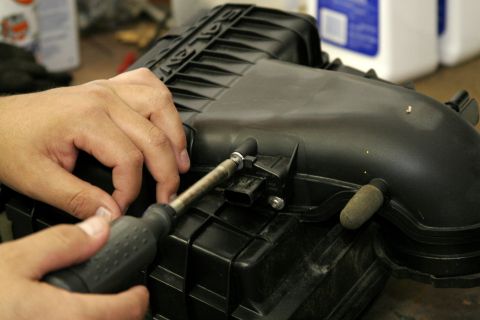 2005 Ford F-150 - A special bit to remove the MAF sensor is included with the intake, remove and save the screws, then carefully remove the MAF sensor from t…
