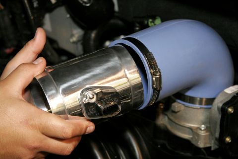 2005 Ford F-150 - Mount the new MAF housing with sensor installed into the elbow fitting on the engine with the flow arrow pointing towards the elbow, at thi…