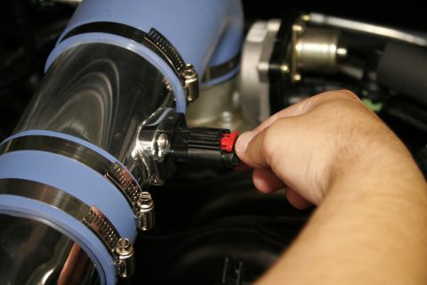 2005 Ford F-150 - Reconnect the MAF sensor to its harness lead by pressing in until it locks.