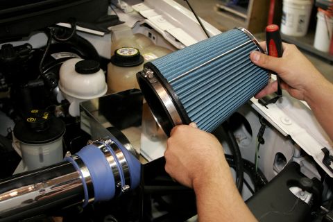 2005 Ford F-150 - Using the largest clamp, attach the new MAC filter to the mounting flange and tighten it in place.