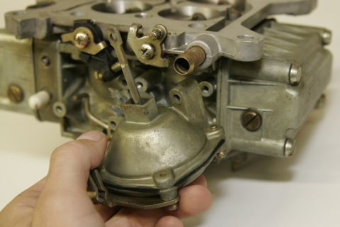 1967 Ford Mustang - With the choke, screws and clip removed, pull the old vacuum solenoid away from the main body. There is a small gasket around the vacuum po…
