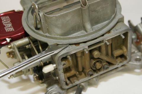 1967 Ford Mustang - The metering blocks can be a real hassle to remove. We were able to get this one off using a large screwdriver and prying very carefully. I…