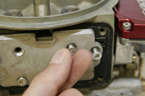 1967 Ford Mustang - Since we are converting this carb to have two metering blocks, the original secondary metering plate will need to come out. These fasteners…