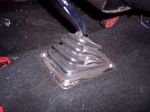 1972 Ford Ranchero - Close-up of a vehicle's interior showing a gear shifter boot and part of a pedal.